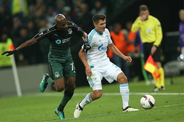 KRASNODAR, RUSSIA - OCTOBER 20, 2016: FC Krasnodar s Charles Kabore (L) and FC Schalke 04 s Alessandro Schoepf fight for the ball in their 2016 17 Season UEFA Europa League Group I Round 3 football match at Krasnodar Stadium. FC Schalke 04 won the game 1-0. Vitaly Timkiv TASS  TS0350DD