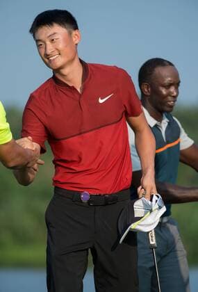 October 23, 2016 - Haikou, Hainan, China - China PGA Golf Herren No1 player, Li Haotong,beats international competition to take the pro prize of USD$250 000 at Blackstone course in Mission Hills resort Haikou during the 2nd round of the 4th World celebrity Pro-am. .Blackstone course, Mission Hills resort, Haikou, Hainan Island China. Round 2 of the Mission Hills 4th World celebrity Pro-Am tournament 2016 - ZUMAr144 20161023_zap_r144_036