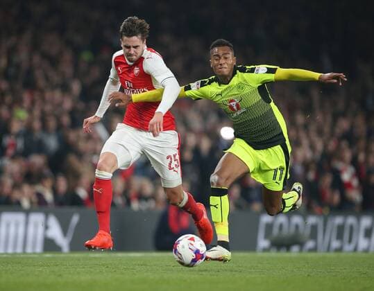 Arsenal s Carl Jenkinson tussles with Reading s Jordan Obita during the EFL Cup match at the Emirates Stadium, London. Picture date October 25th, 2016 Pic David Klein Sportimage EDITORIAL USE ONLY. No use with unauthorised audio, video, data, fixture lists, club league logos or live services. Online in-match use limited to 120 images, no video emulation. No use in betting, games or single club league player publications.