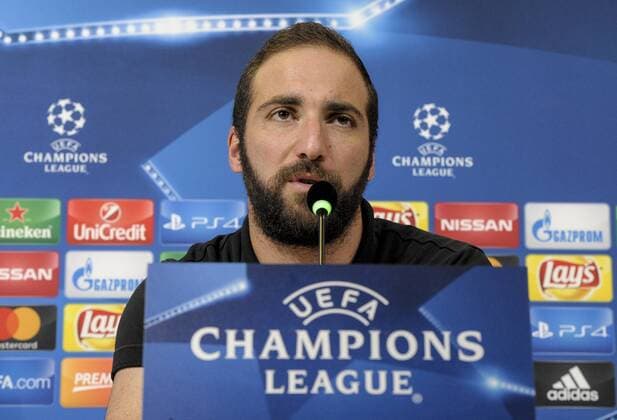 Italy: Juventus FC v Olympique Lyonnais Gonzalo Higuain speaks during a Juventus FC press conference PK Pressekonferenz ahead of the UEFA Champions League Group H match between Juventus FC and Olympique Lyonnais at the Juventus Stadium.  NicoloxCampox xPacificxPress