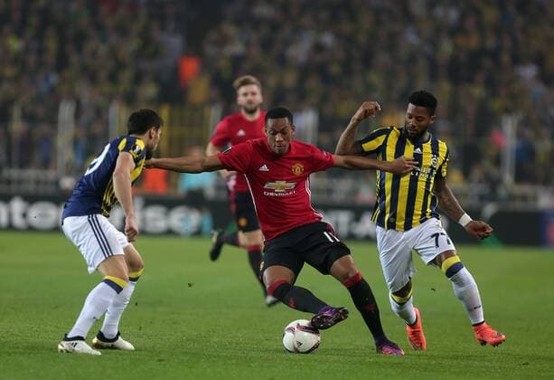 Manchester United ManU s Anthony Martial and Fenerbahce s Jeremain Lens vie for the ball during a UEFA European League, group A soccer match, between Fenerbahce and Manchester United at Fenerbahce Ulker Arena in Istanbul, 3rd of November, 2016. (Tolga Adanali - Depo Photos)  15552927