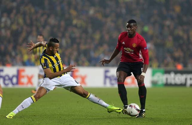 Manchester United ManU s Paul Pogbaand Fenerbahce s Josef De Souza vie for the ball during a UEFA European League, group A soccer match, between Fenerbahce and Manchester United at Fenerbahce Ulker Arena in Istanbul, 3rd of November, 2016. (Tolga Adanali - Depo Photos)  15552940