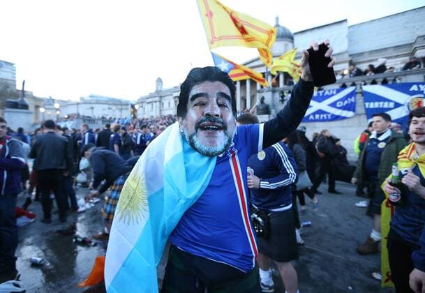 Scotland fan wears a Maradona mask in Trafalgar Square before the FIFA World Cup WM Weltmeisterschaft Fussball Qualifying Group F match at Wembley Stadium, London. Picture date: November 11th, 2016. Pic David Klein Sportimage EDITORIAL USE ONLY. No use with unauthorised audio, video, data, fixture lists, club league logos or live services. Online in-match use limited to 120 images, no video emulation. No use in betting, games or single club league player publications.