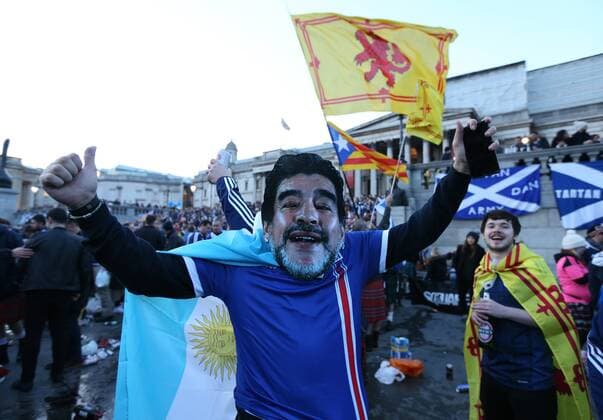 Scotland fan wears a Maradona mask in Trafalgar Square before the FIFA World Cup WM Weltmeisterschaft Fussball Qualifying Group F match at Wembley Stadium, London. Picture date: November 11th, 2016. Pic David Klein Sportimage EDITORIAL USE ONLY. No use with unauthorised audio, video, data, fixture lists, club league logos or live services. Online in-match use limited to 120 images, no video emulation. No use in betting, games or single club league player publications.