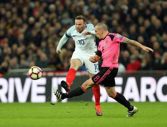 England s Wayne Rooney tussles with Scotland s Scott Brown during the World Cup Qualifying match at Wembley Stadium, London. Picture date November 11th, 2016 Pic David Klein Sportimage EDITORIAL USE ONLY. No use with unauthorised audio, video, data, fixture lists, club league logos or live services. Online in-match use limited to 120 images, no video emulation. No use in betting, games or single club league player publications.