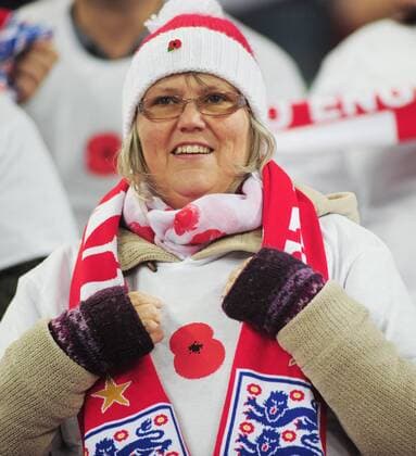 Football - 2016 2017 World Cup Qualifier - Group F: England vs. Scotland England supporter wearing her poppy at Wembley. COLORSPORT ANDREW COWIE 