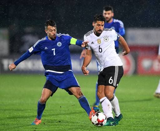 SAN MARINO, Nov. 11, 2016 -- Germany s Sami Khedira (front R) vies for the ball with San Marino s Matteo Vitaioli during their 2018 World Cup Group C qualifying soccer match at the Serravalle stadium in San Marino, Nov. 11, 2016. Germany won 8-0. ) (SP)SAN MARINO-FOOTBALL FIFA World Cup WM Weltmeisterschaft Fussball QUALIFIER-GERMANY VS SAN MARINO AlbertoxLingria 