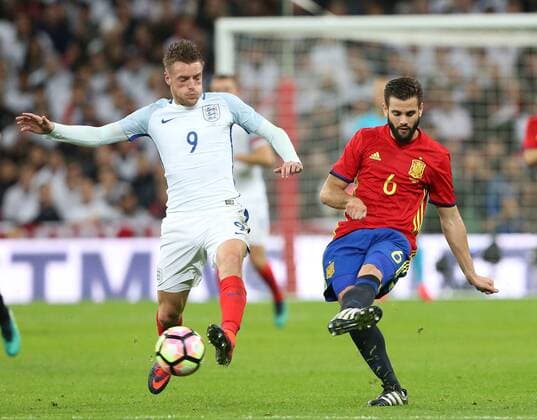 England s Jamie Vardy tussles with Spain s Nacho during the friendly match at Wembley Stadium, London. Picture date November 15th, 2016 Pic David Klein Sportimage EDITORIAL USE ONLY. No use with unauthorised audio, video, data, fixture lists, club league logos or live services. Online in-match use limited to 120 images, no video emulation. No use in betting, games or single club league player publications.