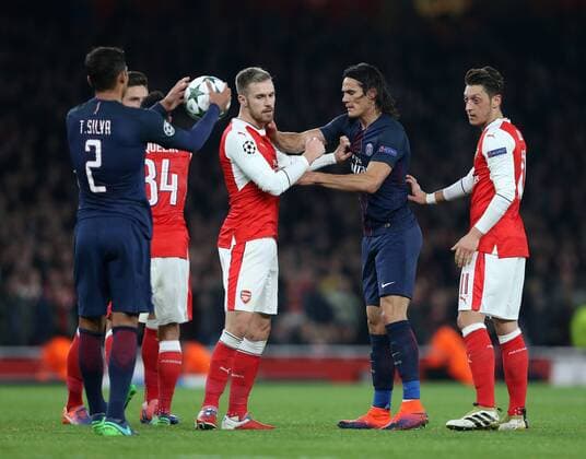 PSG s Edinson Cavani catches ArsenalâÄ?s Aaron Ramsey during the Champions League group A match at the Emirates Stadium, London. Picture date November 23rd, 2016 Pic David Klein Sportimage EDITORIAL USE ONLY. No use with unauthorised audio, video, data, fixture lists, club league logos or live services. Online in-match use limited to 120 images, no video emulation. No use in betting, games or single club league player publications.