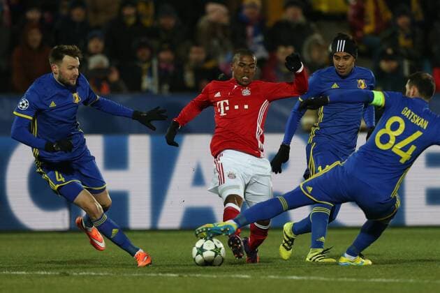 November 23, 2016 - Rostov-On-Don, Russia - Douglas Costa (C) of FC Bayern Munich vie for the ball during the UEFA Champions League Group D football match between FC Bayern Munich and FC Rostov, at Olimp 2 Stadium in Rostov-on-Don, Russia on Novemberr 23, 2016. FC Rostov v FC Bayern Muenchen - UEFA Champions League  - ZUMAn230 20161123_zaa_n230_166