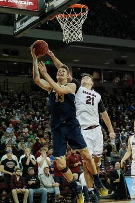 November 23, 2016: Moritz Wagner (13) of the Michigan Wolverines gets a layup under Maik Kotsar (21) of the South Carolina Gamecocks in the NCAA College League USA Basketball matchup between the Michigan Wolverines and the South Carolina Gamecocks at Colonial Life Arena in Columbia, SC. ( Cal Media) NCAA Basketball: Michigan vs USC NOV 23 - ZUMAc04_ 20161123_zaf_c04_065
