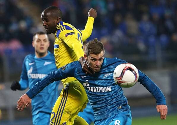 ST PETERSBURG, RUSSIA â€“ NOVEMBER 24, 2016: Zenit St Petersburgâ€™s Nicolas Lombaerts (fR ront) and Maccabi Tel-Avivâ€™s Elazar Eli Dasa (L front) in their 2016 2017 UEFA Europa League Round 5 Group D football match at Petrovsky Stadium. Zenit St Petersburg won 2-0. Peter Kovalev TASS  TS038BCF