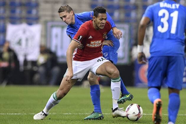 Genk s Timothy Castagne and Rapid s Joelinton fight for the ball during a game of the fifth day of the group stage (Group F) of the Europa League competition between Belgian soccer team RC Genk and Austrian team Rapid Wien, Thursday 24 November 2016, in Genk. YORICKxJANSENS  x04982808x