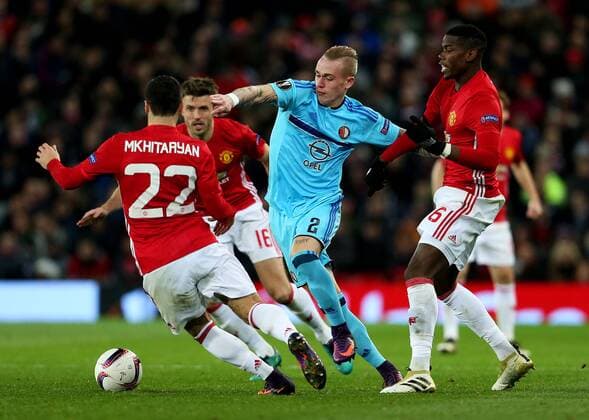 Rick Karsdorp of Feyenoord takes on Henrikh Mkhitaryan of Manchester United ManU during the UEFA Europa League match at Old Trafford, Manchester. Picture date: November 24th 2016. Pic Matt McNulty Sportimage EDITORIAL USE ONLY. No use with unauthorised audio, video, data, fixture lists, club league logos or live services. Online in-match use limited to 120 images, no video emulation. No use in betting, games or single club league player publications.