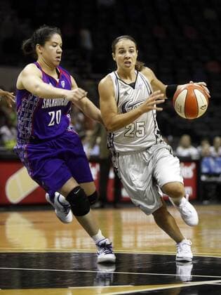 SPORTS - The San Antonio Silver Stars Becky Hammon, right, goes up against the Sacramento Monarchs Kara Lawson, left, at the AT&T Center in San Antonio on Tuesday, August 11, 2009. LISA KRANTZ lkrantz@express-news.net Texas News - August 11, 2009 - ZUMAa27_ 20090811_zaf_a27_012