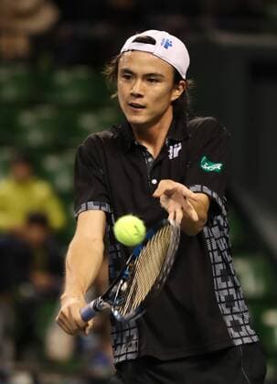 November 26, 2016, Tokyo, Japan - Japan s Taro Daniel returns the ball against former French Opens Tennis champion Michael Chang of the United States during an annual charity tennis match Dream Tennis Ariake in Tokyo on Saturday, November 26, 2016. Admission money will be donated for the rebuild of tennis facilities at the tsunami affected area in northern Japan. NOxTHIRDxPARTYxSALES.  (lwxa006488)