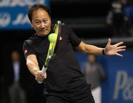 November 26, 2016, Tokyo, Japan - Former French Opens Tennis champion Michael Chang of the United States returns the ball against Japan s Taro Daniel during an annual charity tennis match Dream Tennis Ariake in Tokyo on Saturday, November 26, 2016. Admission money will be donated for the rebuild of tennis facilities at the tsunami affected area in northern Japan. NOxTHIRDxPARTYxSALES.  (lwxa006485)