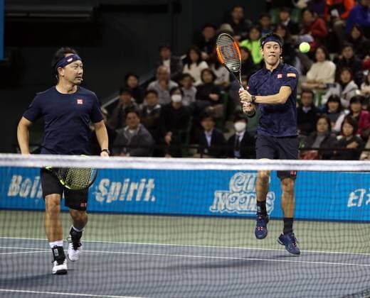 November 26, 2016, Tokyo, Japan - Japan s Kei Nishikori and his coach former French Opens Tennis champion Michael Chang of the United States pair return the ball against Andy Roddick of the United States and Japan s Taro Daniel during an annual charity tennis match Dream Tennis Ariake in Tokyo on Saturday, November 26, 2016. Admission money will be donated for the rebuild of tennis facilities at the tsunami affected area in northern Japan. NOxTHIRDxPARTYxSALES.  (lwxa006499)