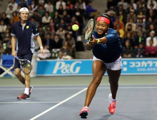 November 26, 2016, Tokyo, Japan - Japan s Taro Daniel and Naomi Osaka pair return the ball against Japan s Kei Nishikori and Nao Hibino pair during an annual charity tennis match Dream Tennis Ariake in Tokyo on Saturday, November 26, 2016. Admission money will be donated for the rebuild of tennis facilities at the tsunami affected area in northern Japan. NOxTHIRDxPARTYxSALES.  (lwxa006503)