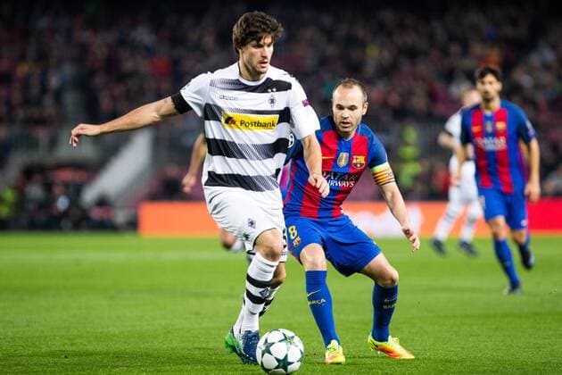VfL Borussia Monchengladbach s Tobias Strobl, FC Barcelona Barca s Andres Iniesta during Champions League match between Futbol Club Barcelona and VfL Borussia Mönchengladbach at Camp Nou Stadium in Barcelona , Spain. December 06, 2016.  (20161206026)