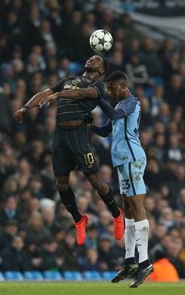 Moussa Dembele of Celtic tussles with Tosin Adarabioyo of Manchester City during the Champions League Group C match at the Etihad Stadium, Manchester. Picture date: December 6th, 2016. Pic Simon Bellis Sportimage EDITORIAL USE ONLY. No use with unauthorised audio, video, data, fixture lists, club league logos or live services. Online in-match use limited to 120 images, no video emulation. No use in betting, games or single club league player publications.