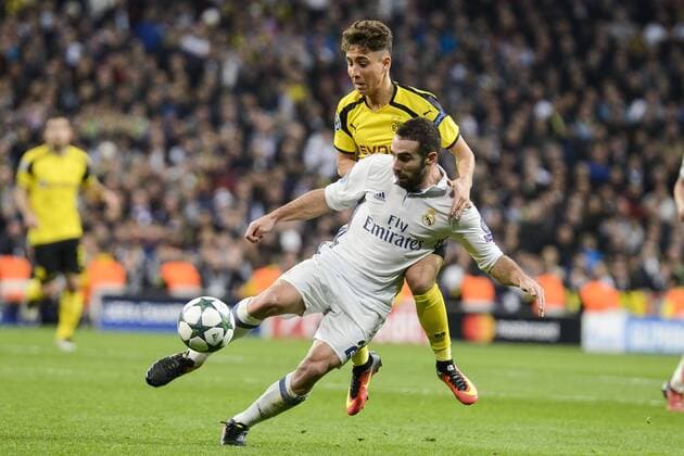 Real Madrid s Daniel Carvajal and Borussia Dortmund OEmre Mor during the UEFA Champions League match between Real Madrid and Borussia Dortmund at Santiago Bernabeu Stadium in Madrid, Spain. December 07, 2016.  (20161207036)