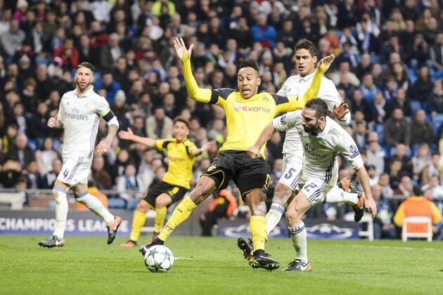 Real Madrid s Raphael Varane and Daniel Carvajal and Borussia Dortmund Pierre-Emerick Aubameyang during the UEFA Champions League match between Real Madrid and Borussia Dortmund at Santiago Bernabeu Stadium in Madrid, Spain. December 07, 2016.  (20161207056)