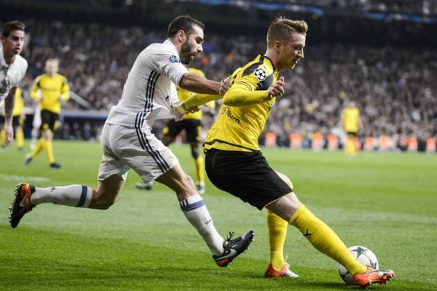 Real Madrid s Daniel Carvajal and Borussia Dortmund Marco Reus during the UEFA Champions League match between Real Madrid and Borussia Dortmund at Santiago Bernabeu Stadium in Madrid, Spain. December 07, 2016.  (20161207048)