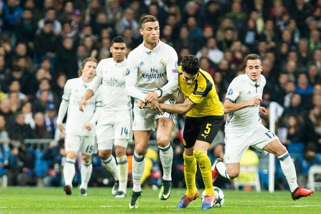 Real Madrid s Cristiano Ronaldo, Borussia Dortmund Marc Bartra during Champions League match between Real Madrid and Borussia Dortmund at Santiago Bernabeu Stadium in Madrid , Spain. December 07, 2016.  (20161207039)
