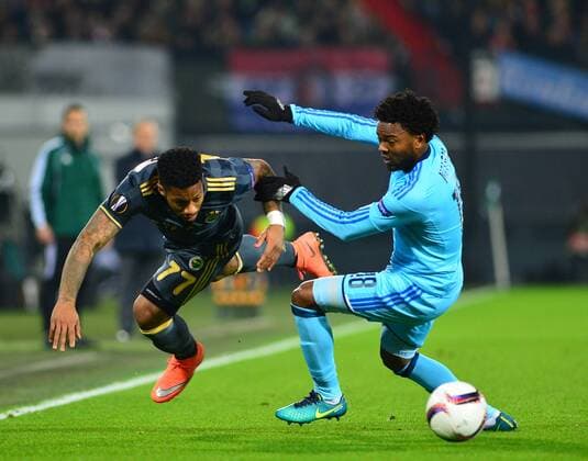 UEFA Europa League Group A day 6 match between Feyenoord and Fenerbahce at De Kuip Stadium in Rotterdam , Netherlands , December 08 , 2016. Pictured: Jeremain Lens of Fenerbahce and Miquel Nelom 18 of Feyenoord. 
