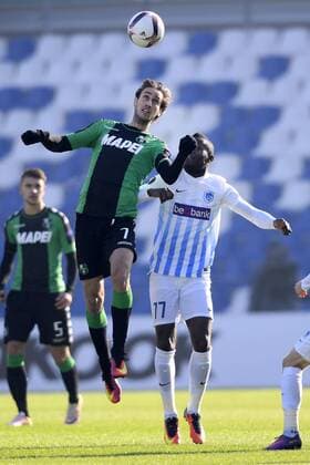 Sassuolo s Simone Missiroli and Genk s Mwbana Ally Samatta fight for the ball during a soccer game between Italian Club U.S. Sassuolo Calcio and Belgian team KRC Genk in Parma, Italy, Friday 09 December 2016, the sixth and last game of the group stage of the Europa League competition, in Group F. The match was scheduled for yesterday, but it was postponed due to heavy fog. YORICKxJANSENS  x04994420x
