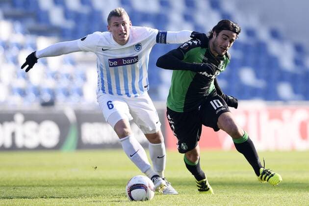 Genk s Sebastien Dewaest and Sassuolo s Alessandro Matri fight for the ball during a soccer game between Italian Club U.S. Sassuolo Calcio and Belgian team KRC Genk in Parma, Italy, Friday 09 December 2016, the sixth and last game of the group stage of the Europa League competition, in Group F. The match was scheduled for yesterday, but it was postponed due to heavy fog. YORICKxJANSENS  x04994439x