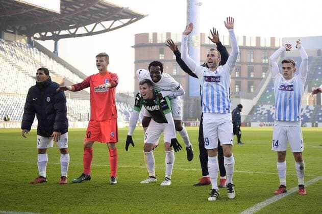 Genk s players celebrate after winning a soccer game between Italian Club U.S. Sassuolo Calcio and Belgian team KRC Genk in Parma, Italy, Friday 09 December 2016, the sixth and last game of the group stage of the Europa League competition, in Group F. The match was scheduled for yesterday, but it was postponed due to heavy fog. YORICKxJANSENS  x04994547x