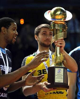 SURGUT, RUSSIA - DECEMBER 17, 2016: Zenit-Kazan s Wilfredo Leon (L) and Valentin Krotkov hold the trophy during an award ceremony for the 2016 Russia Volleyball Cup Final match against Lokomotiv Novosibirsk. Zenit-Kazan won the game 3-1. Roman Kruchinin TASS  TS03B80D