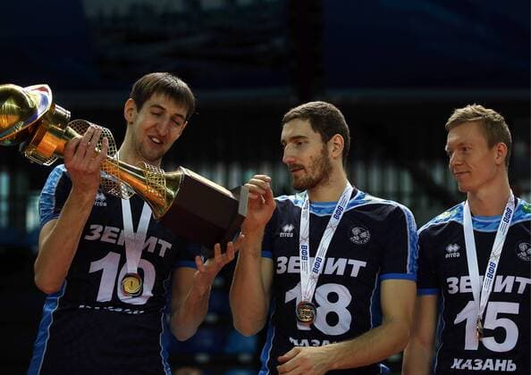 SURGUT, RUSSIA - DECEMBER 17, 2016: Zenit-Kazan s Artyom Volvich, Maxim Mikhailov, and Denis Zemchyonok (L-R) during an award ceremony for the 2016 Russia Volleyball Cup Final match against Lokomotiv Novosibirsk. Zenit-Kazan won the game 3-1. Roman Kruchinin TASS  TS03B80F