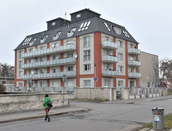 A woman crosses a street in front of the house where Czech tennis player Petra Kvitova has been attacked and injured in her flat in Prostejov, 260 kilometres east of Prague, on Tuesday, Dec. 20, 2016. A knife-wielding intruder attacked two-time Wimbledon tennis champion in her apartment. The world number 11 said she was still waiting for doctors to tell her the extent of her injuries. The worst is already behind me, she said in a statement issued on the Czech Republic Fed Cup team s Facebook page. (CTKxPhoto LudekxPerina) CTKPhotoP201612200569901  DSC_7938