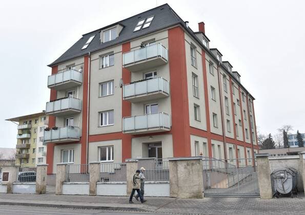 A people stroll in front of the house where Czech tennis player Petra Kvitova has been attacked and injured in her flat in Prostejov, 260 kilometres east of Prague, on Tuesday, Dec. 20, 2016. A knife-wielding intruder attacked two-time Wimbledon tennis champion in her apartment. The world number 11 said she was still waiting for doctors to tell her the extent of her injuries. The worst is already behind me, she said in a statement issued on the Czech Republic Fed Cup team s Facebook page. (CTKxPhoto LudekxPerina) CTKPhotoP201612200570001  DSC_7939
