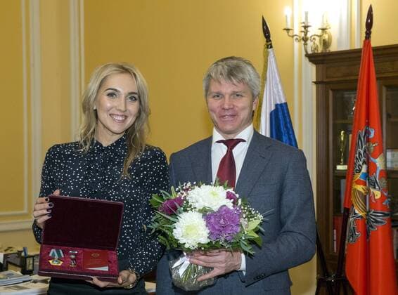 MOSCOW, RUSSIA - DECEMBER 26, 2016: Russian tennis player Elena Vesnina (L) and Russia s Sports Minister Pavel Kolobkov at an award ceremony at the offices of the Russian Sports Ministry. Russian tennis players Elena Vesnina and Ekaterina Makarova are awarded for their victory in the women s doubles tennis event at the 2016 Summer Olympic Games Olympische Spiele Olympia OS in Rio de Janeiro, Brazil. Vladimir Gerdo TASS  TS03CC9A