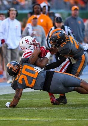 December 30, 2016: Terrell Newby 34 getting tackled by Cortez McDowell 20 in the game between the Nebraska Cornhuskers and the Tennessee Volunteers in the Franklin American Mortgage Music City Bowl at Nissan Stadium in Nashville, TN. Thomas McEwen CSM NCAA College League USA Football 2016: Franklin American Mortgage Music City Bowl Nebraska vs Tennessee DEC 30 - ZUMAc04_ 20161230_zaf_c04_063