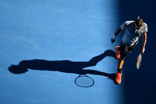 January 18, 2017: Roger Federer of Switzerland casts a shadow in the afternoon sun in a 2nd round match against Noah Rubin of the USA on day three of the 2017 Australian Open Grand Slam tennis tournament in Melbourne, Australia. Cal Media Tennis 2017: Australian Open Jan 18 - ZUMAc04_ 20170118_zaf_c04_072