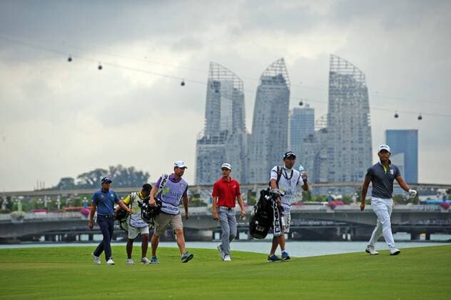 (170120) -- SINGAPORE, Jan. 20, 2017 -- Satoshi Kodaira(1st R) of Japan, Brett Coletta (3rd R) of Australia and Pavit Tangkamolprasert(1st L) of Thailand walk off during the SMBC Singapore Open at Singapore s Sentosa Golf Club, Jan. 20, 2017. ) (SP)SINGAPORE-GOLF-SMBC SINGAPORE OPEN ThenxChihxWey 