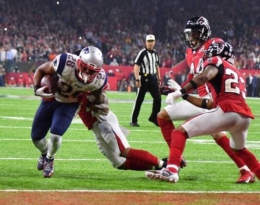 New England Patriots running back James White (28) takes the ball over the goal line for the winning touchdown against the Atlanta Falcons in overtime in Super Bowl LI at NRG Stadium in Houston on February 5, 2017. The Patriots came from behind to defeat the Falcons 34-28 in overtime.  SBP20170205487 KEVINxDIETSCH