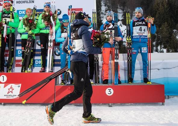 HOCHFILZEN, AUSTRIA - FEBRUARY 9, 2017: Silver medalist Martin Fourcade of France (front), gold medalists Arnd Peiffer, Laura Dahlmeier, Vanessa Hinz of Germany, and bronze medalists Olga Podchufarova, Tatyana Akimova, Alexander Loginov, Anton Shipulin of Russia (L-R back), at an award ceremony for the 2 6 km + 2 7.5 km Mixed Relay event at the 2017 IBU Biathlon World Championships in Hochfilzen, Austria. Stanislav Krasilnikov TASS TS040856