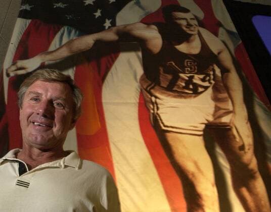 --Wednesday, July 19, 2000, Sacramento, Calif.-- Al Oerter, a four-time Olympic gold medalist in the discus in 1956-60-64-68, stands in front of a poster with his likeness at the Sacramento Convention Center Wednesday morning. Oerter is among the athelets honored in the Xerox Century of Champions. ( The Sacramento Bee ) ZUMA Press Sacramento Bee Image Archive - ZUMAs76_ 77314342st Copyright: xHectorxAmezcuax