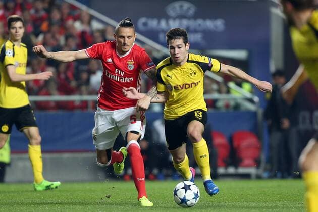 February 14, 2017 - Lisbon, Portugal - Dortmund s defender Raphael Guerreiro ( R) fights for the ball with Benfica s midfielder Ljubomir Fejsa during the UEFA Champions League round of 16 first leg football match SL Benfica vs Borussia Dortmund at the Luz stadium in Lisbon Portugal on February 14, 2017. SL Benfica v Borussia Dortmund - UEFA Champions League Round of 16: First Leg  - ZUMAn230 20170214_zaa_n230_486 Copyright: xPedroxFiuzax
