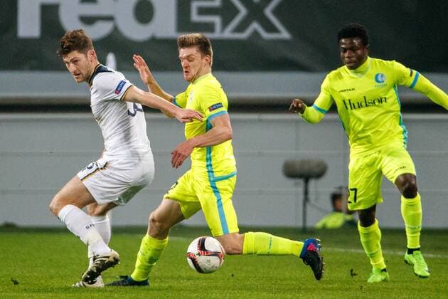 Tottenham s defender Ben Davies and Gent s Thomas Foket fight for the ball during a game between Belgian soccer team KAA Gent and British team Tottenham, first-leg of the 1 16 finals of the Europa League competition, Thursday 16 February 2017, in Gent. KURTxDESPLENTER  x05048748x