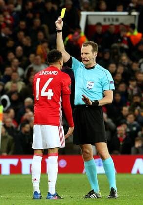 Jesse Lingard of Manchester United ManU receives a yellow card during the UEFA Europa League Round of 32 1st leg match at Old Trafford Stadium, Manchester. Picture date: February 16th, 2017. Pic credit should read: Matt McNulty Sportimage EDITORIAL USE ONLY. No use with unauthorised audio, video, data, fixture lists, club league logos or live services. Online in-match use limited to 120 images, no video emulation. No use in betting, games or single club league player publications.