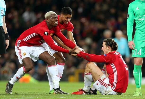 Paul Pogba helps as Marcus Rashford struggles to lift up Zlatan Ibrahimovic of Manchester United ManU during the UEFA Europa League Round of 32 1st leg match at Old Trafford Stadium, Manchester. Picture date: February 16th, 2017. Pic credit should read: Matt McNulty Sportimage EDITORIAL USE ONLY. No use with unauthorised audio, video, data, fixture lists, club league logos or live services. Online in-match use limited to 120 images, no video emulation. No use in betting, games or single club league player publications.