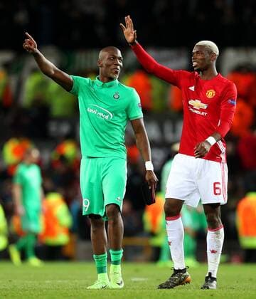Paul Pogba of Manchester United ManU and brother Florentin Pogba of Saint Etienne at full time during the UEFA Europa League Round of 32 1st leg match at Old Trafford Stadium, Manchester. Picture date: February 16th, 2017. Pic credit should read: Matt McNulty Sportimage EDITORIAL USE ONLY. No use with unauthorised audio, video, data, fixture lists, club league logos or live services. Online in-match use limited to 120 images, no video emulation. No use in betting, games or single club league player publications.