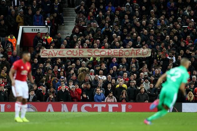 Manchester United ManU fans hold up a Save our Scoreboard banner during the UEFA Europa League Round of 32 1st leg match at Old Trafford Stadium, Manchester. Picture date: February 16th, 2017. Pic credit should read: Matt McNulty Sportimage EDITORIAL USE ONLY. No use with unauthorised audio, video, data, fixture lists, club league logos or live services. Online in-match use limited to 120 images, no video emulation. No use in betting, games or single club league player publications.